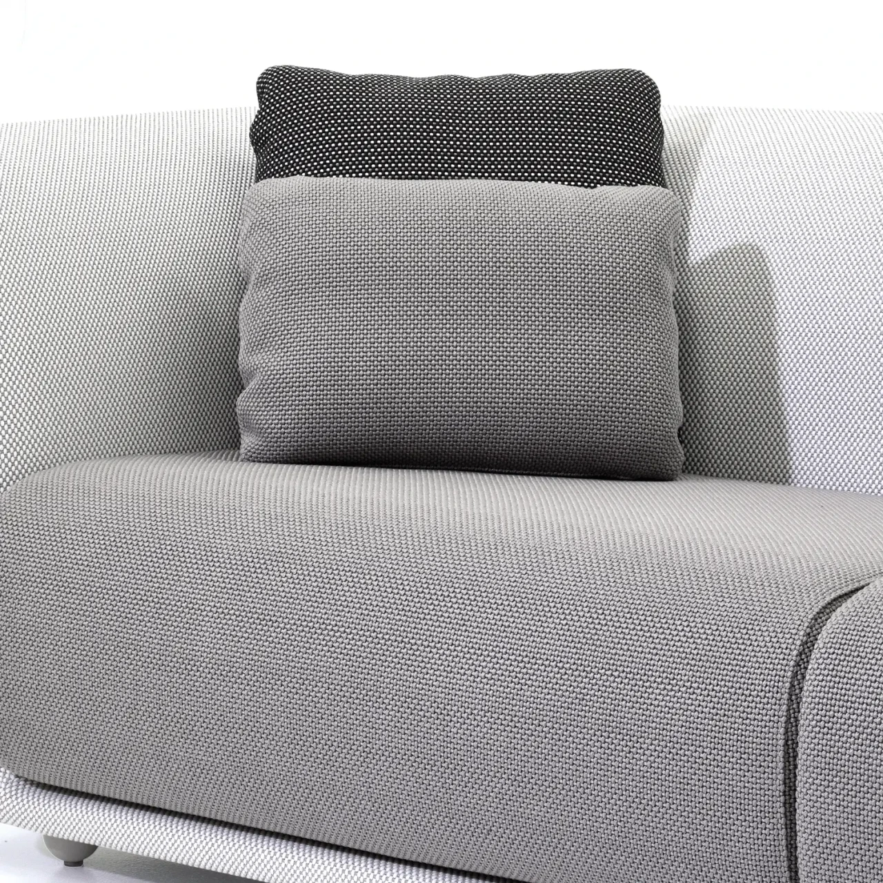 STEEL - Vondom Suave Outdoor Pillow in Getaria Steel Grey 100% polypropylene, modern style, close-up side view in living setting.