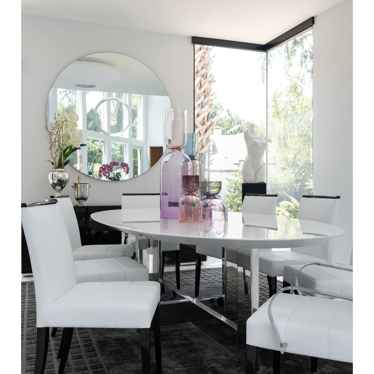 Malerba One And Only Arm Chair in White Leather with Polished Stainless Steel arms, modern dining room, three-quarter view.