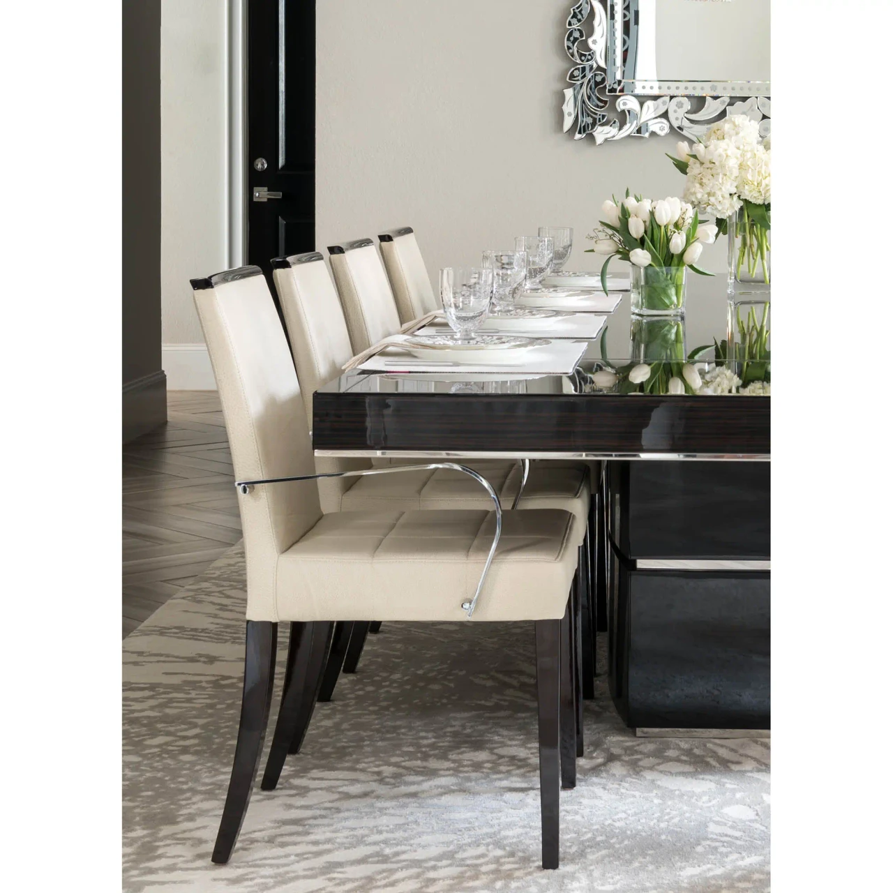 Malerba One And Only Arm Chair in White Leather with Polished Stainless Steel arms, side view in a dining room setting.