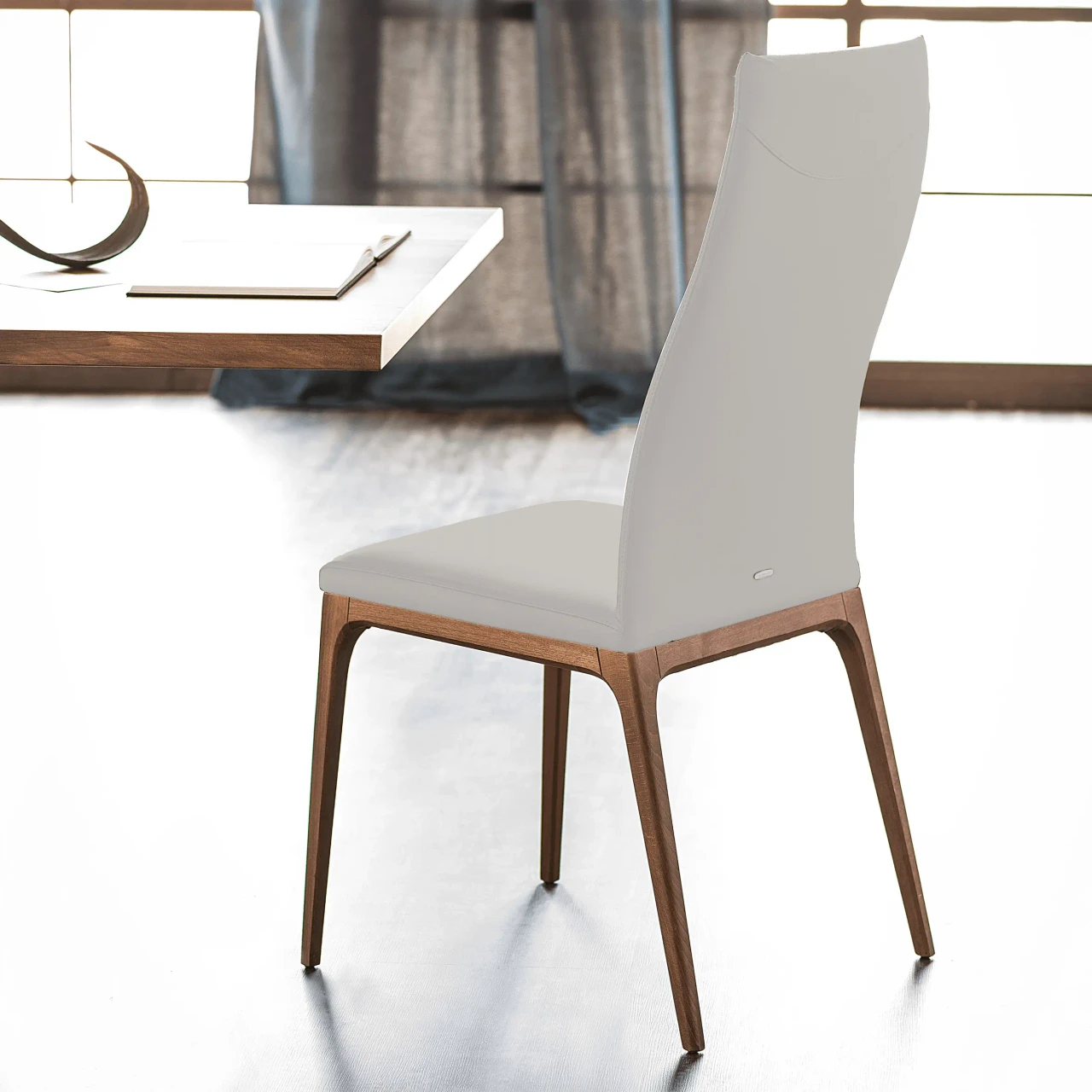 CANOVA || WALNUT - Cattelan Arcadia High Back Side Chair in Canova Soft Leather 972 with Walnut Stained Beech Frame, side view in dining room.