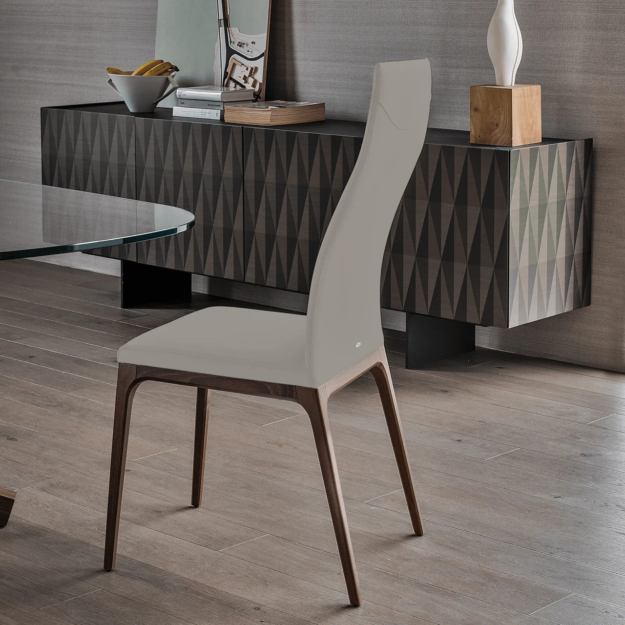 DAKOTA || WENGHE - Cattelan Arcadia High Back Chair in Dakota Soft Leather 938 with Wenghe Stained Beech Frame, side view in dining room