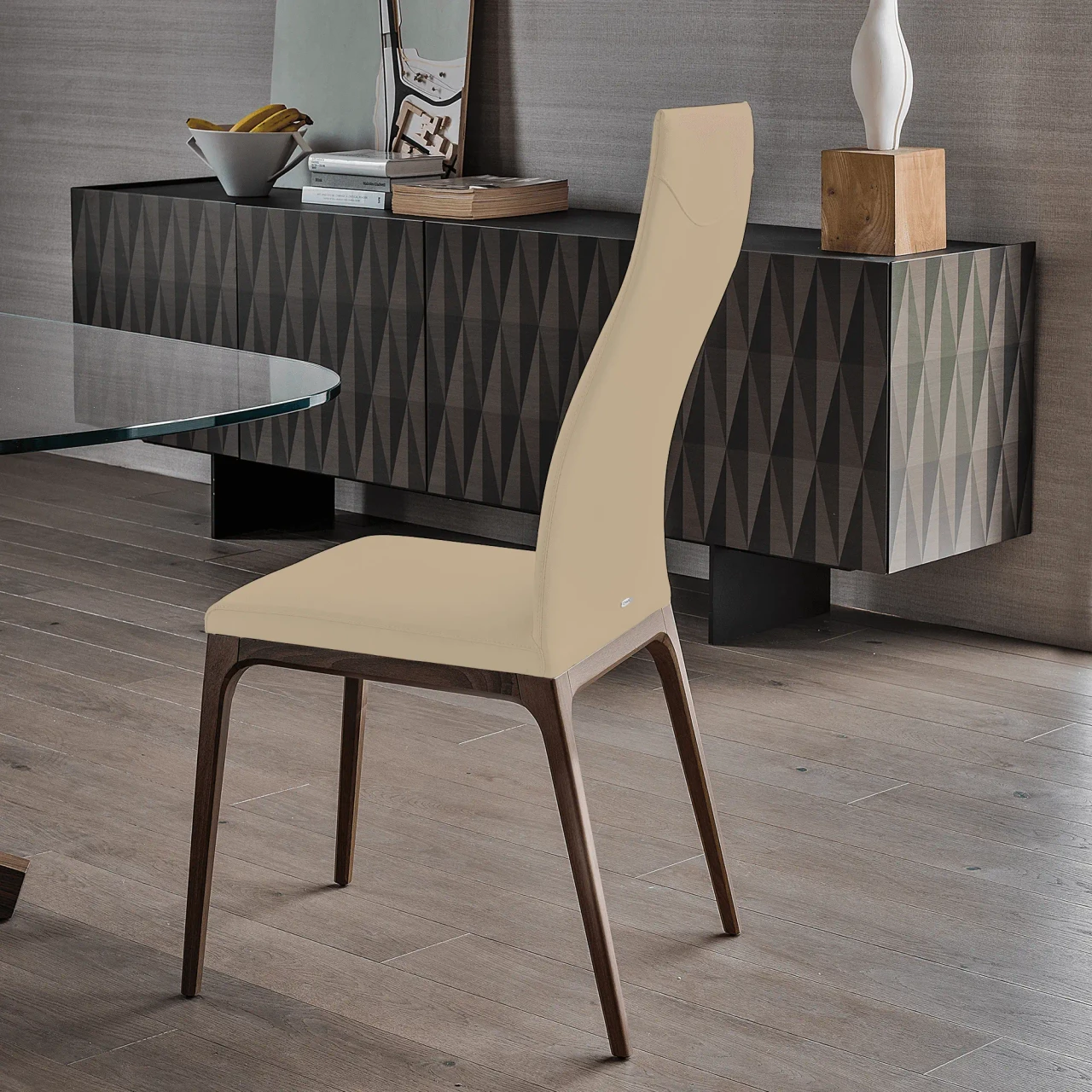CASHMERE || WENGHE - Cattelan Arcadia High Back Chair in Cashmere Soft Leather 969 with Wenghe Stained Beech Frame, side view in dining room.