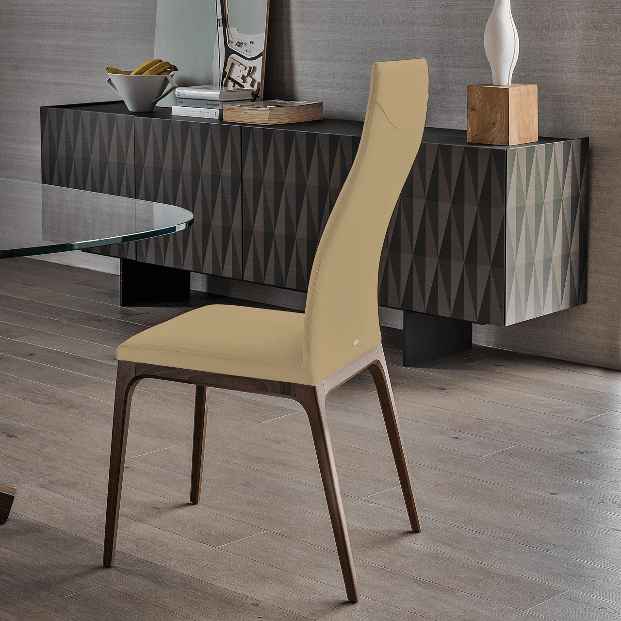 SAFARI || WENGHE - Cattelan Arcadia High Back Chair in Safari Soft Leather with Wenghe Stained Beech Frame, side view in dining room setting.