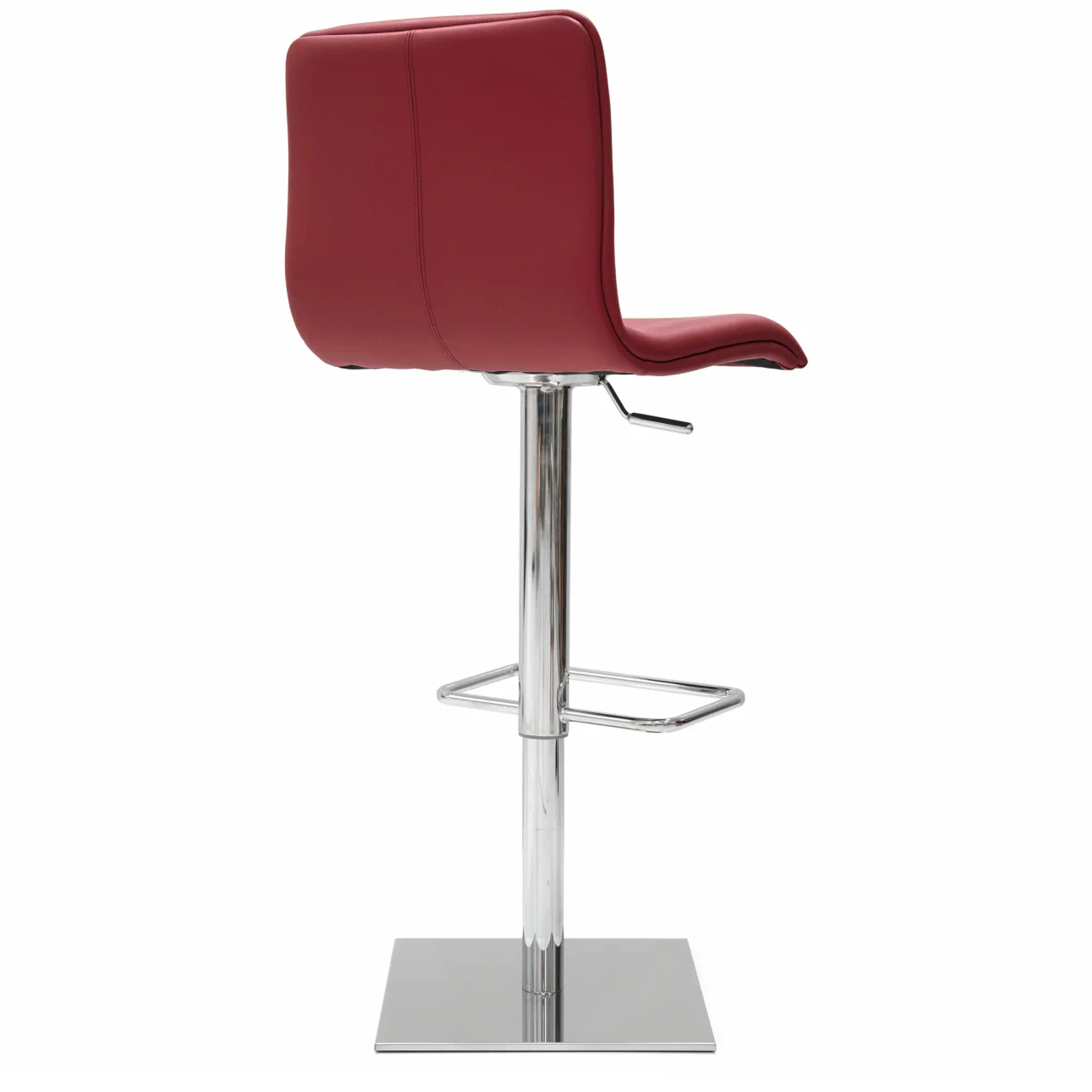 RED LEATHER - Red faux leather modern bar stool with chrome pedestal base, footrest, and height adjustment lever, side view.