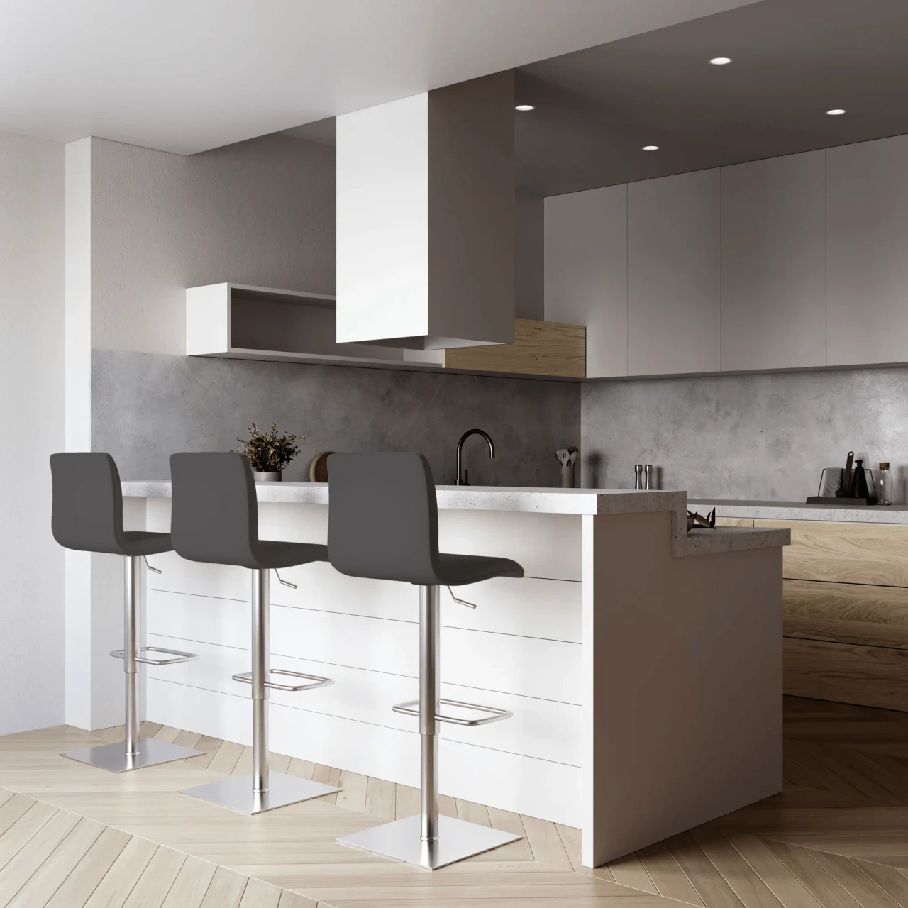 GREY - Three modern grey faux leather bar stools with chrome pedestals and footrests in a white kitchen, front view.