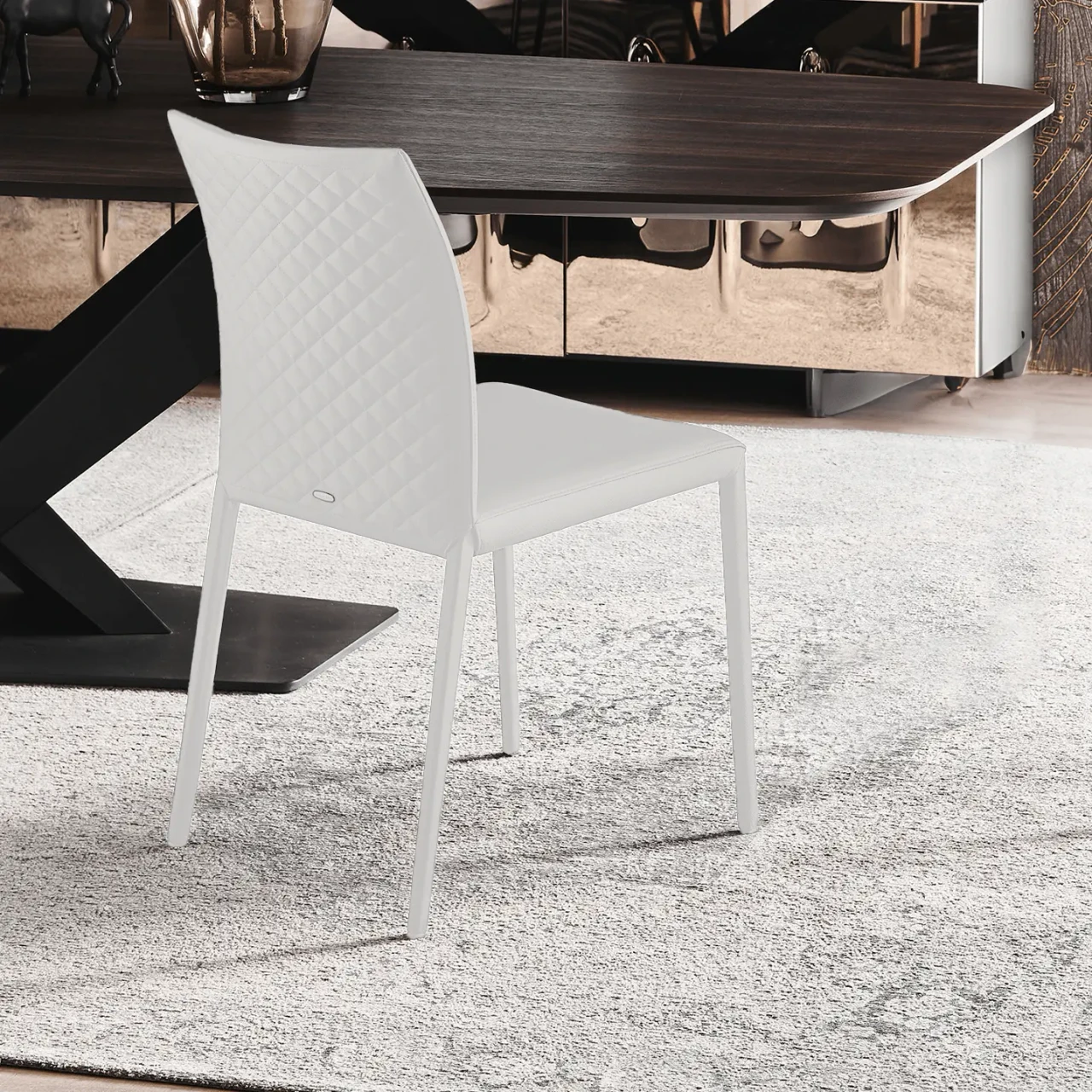 BIANCO - Cattelan Norma Couture Side Chair in Bianco Soft Leather with diamond tufted back, side view in a dining room setting.