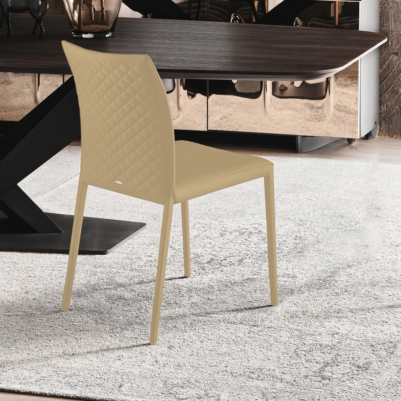 SAFARI - Cattelan Norma Couture Side Chair in Safari Soft Leather with diamond tufted back, side view in a dining room setting.