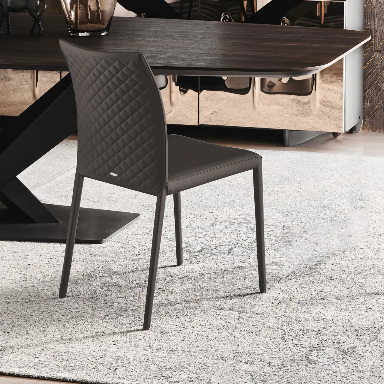 ARDESIA - Cattelan Norma Couture Side Chair in Ardesia Soft Leather with diamond tufted back, rear view in a dining room setting.