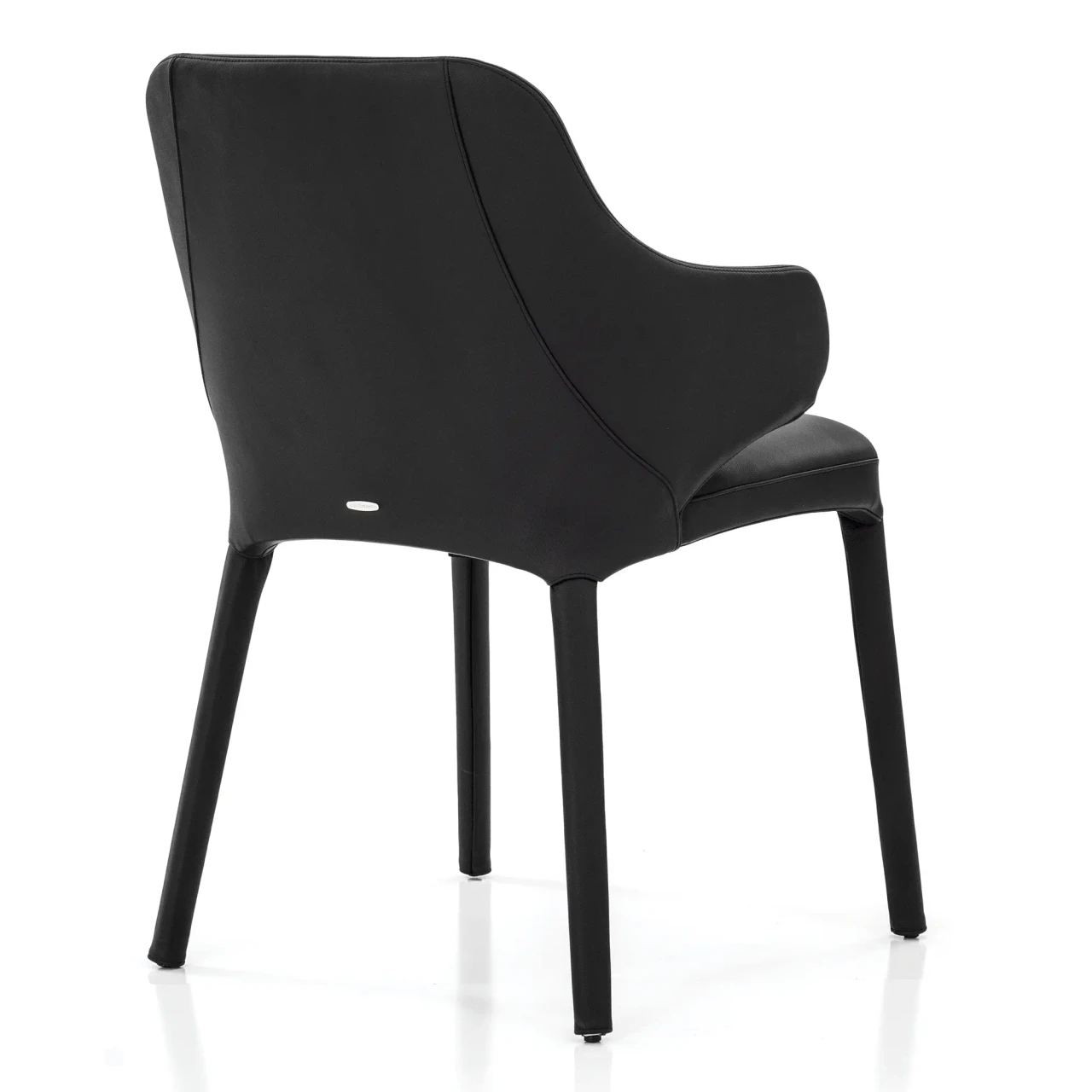 NERO - Cattelan Wanda Arm Chair in Nero Soft Leather, modern style, black leather with tapered legs, rear three-quarter view.