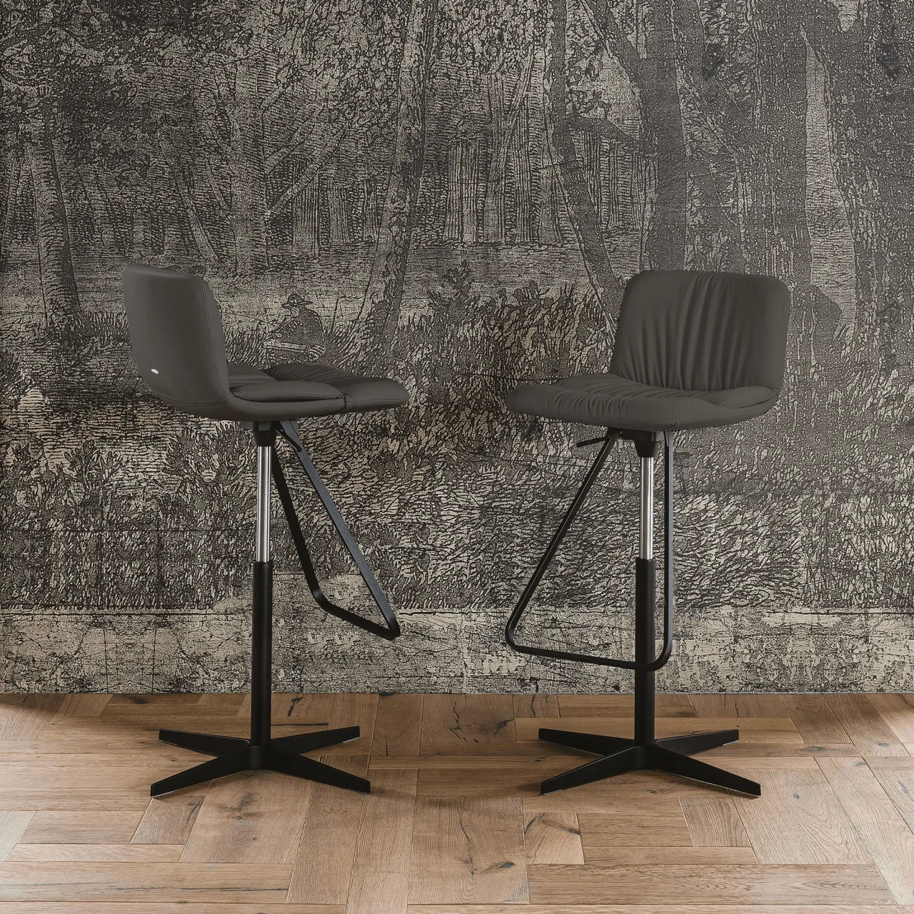 ARDESIA - Two Cattelan Axel X Bar Stools in Ardesia Soft Leather with Black Spoke Base, front view in a lifestyle room setting.