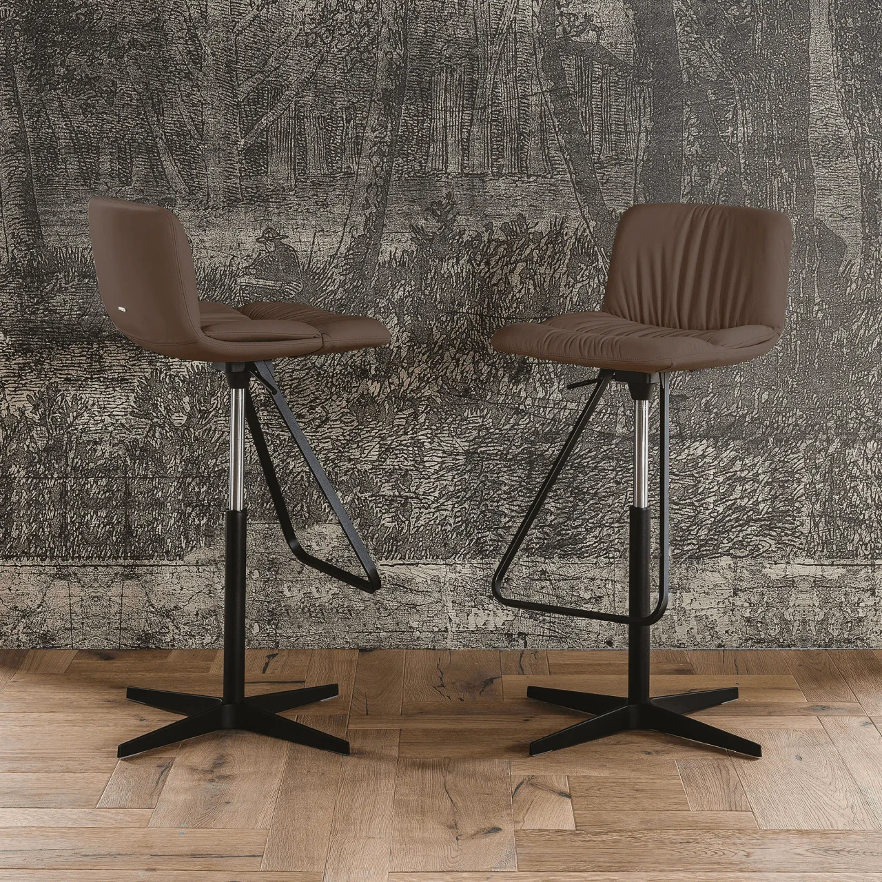 TABACCO - Two Cattelan Axel X Bar Stools in Tabacco Soft Leather with Black Spoke Base, Column & Foot, front view in a dining setting.