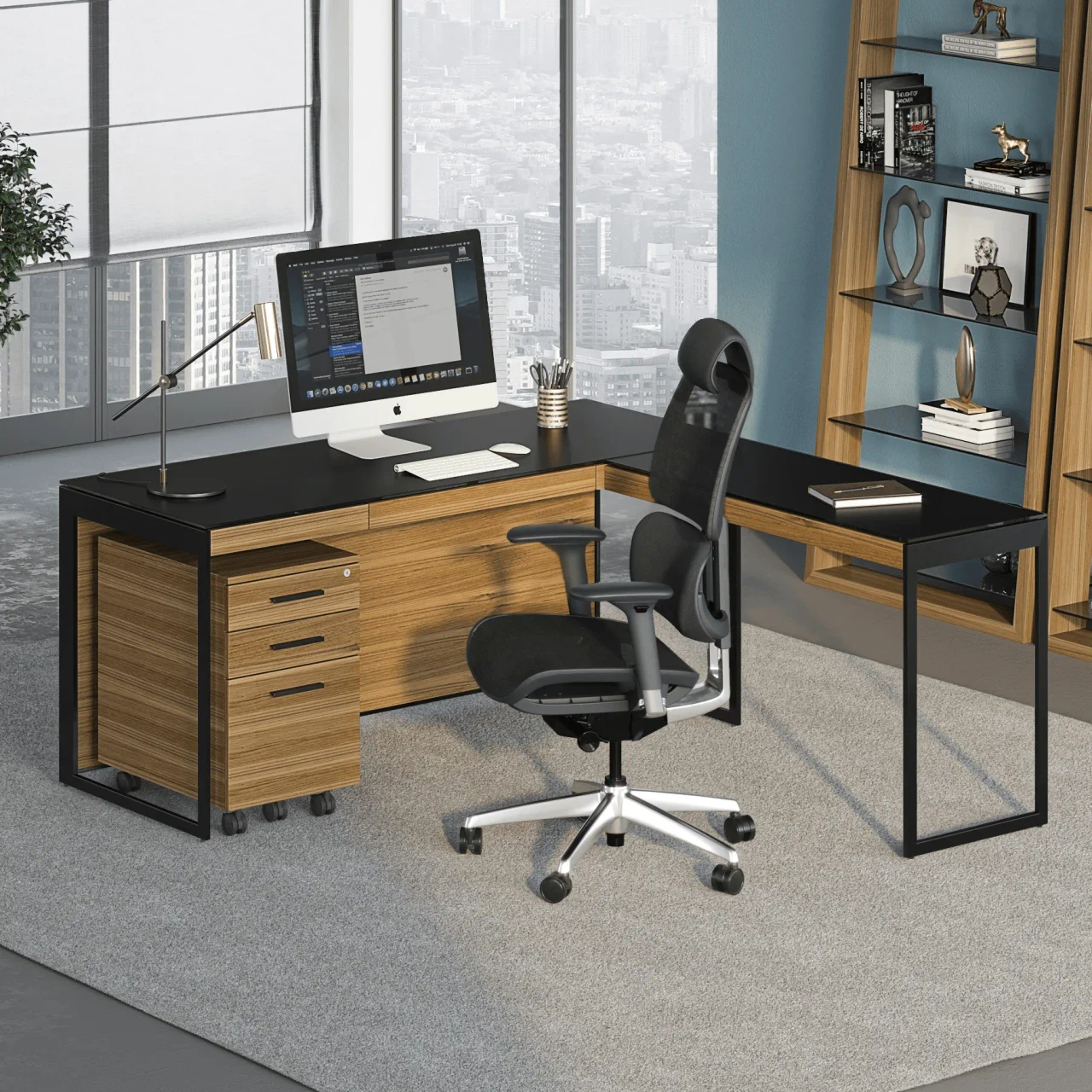 WALNUT - L-shaped modern desk with black top, wood grain drawers, and ergonomic black mesh chair, viewed from a front angle.