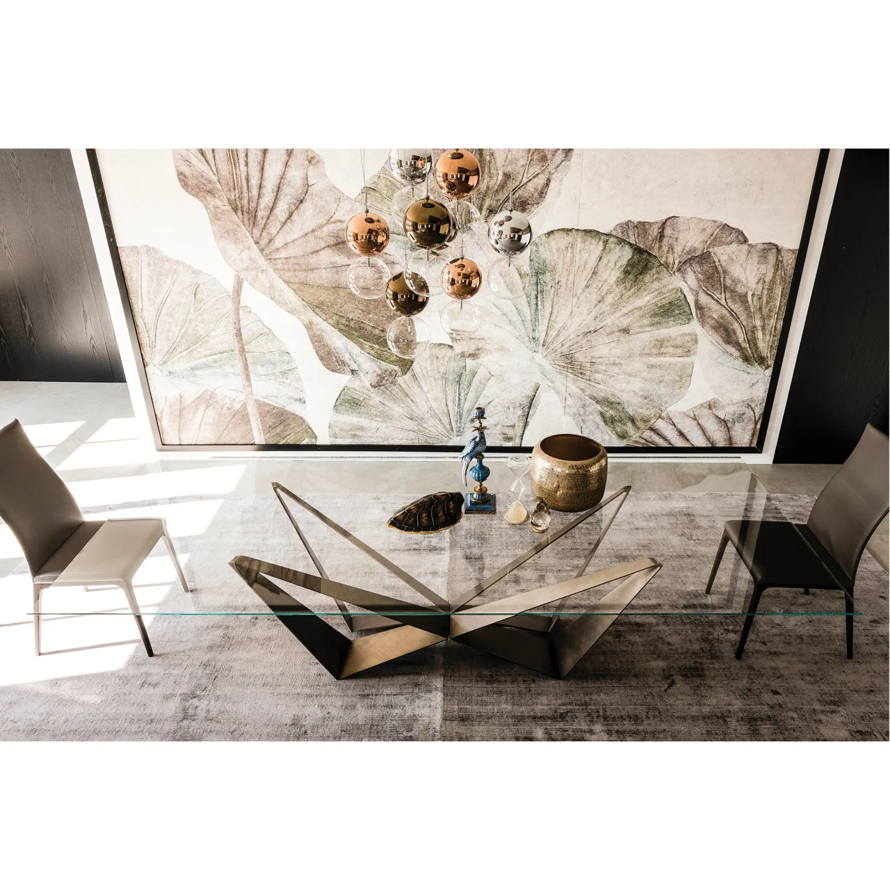 BRUSHED BRONZE - Cattelan Skorpio Glass Dining Table with brushed bronze steel base and clear glass top in a modern dining room, front view.