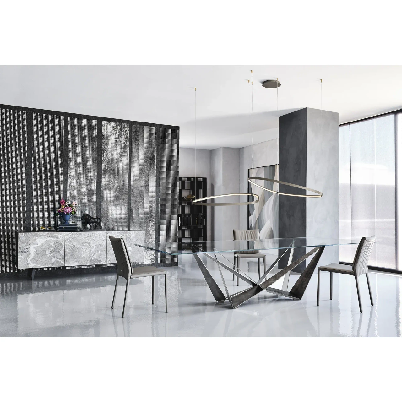 BRUSHED GREY - Cattelan Skorpio Glass Dining Table with brushed grey steel base and clear glass top in a modern dining room, front view.