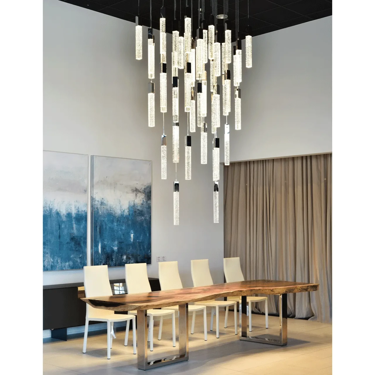 25 - Glacier Suspension Fixture in Polished Chrome and Bubbled Glass, modern dining room setting, front view.