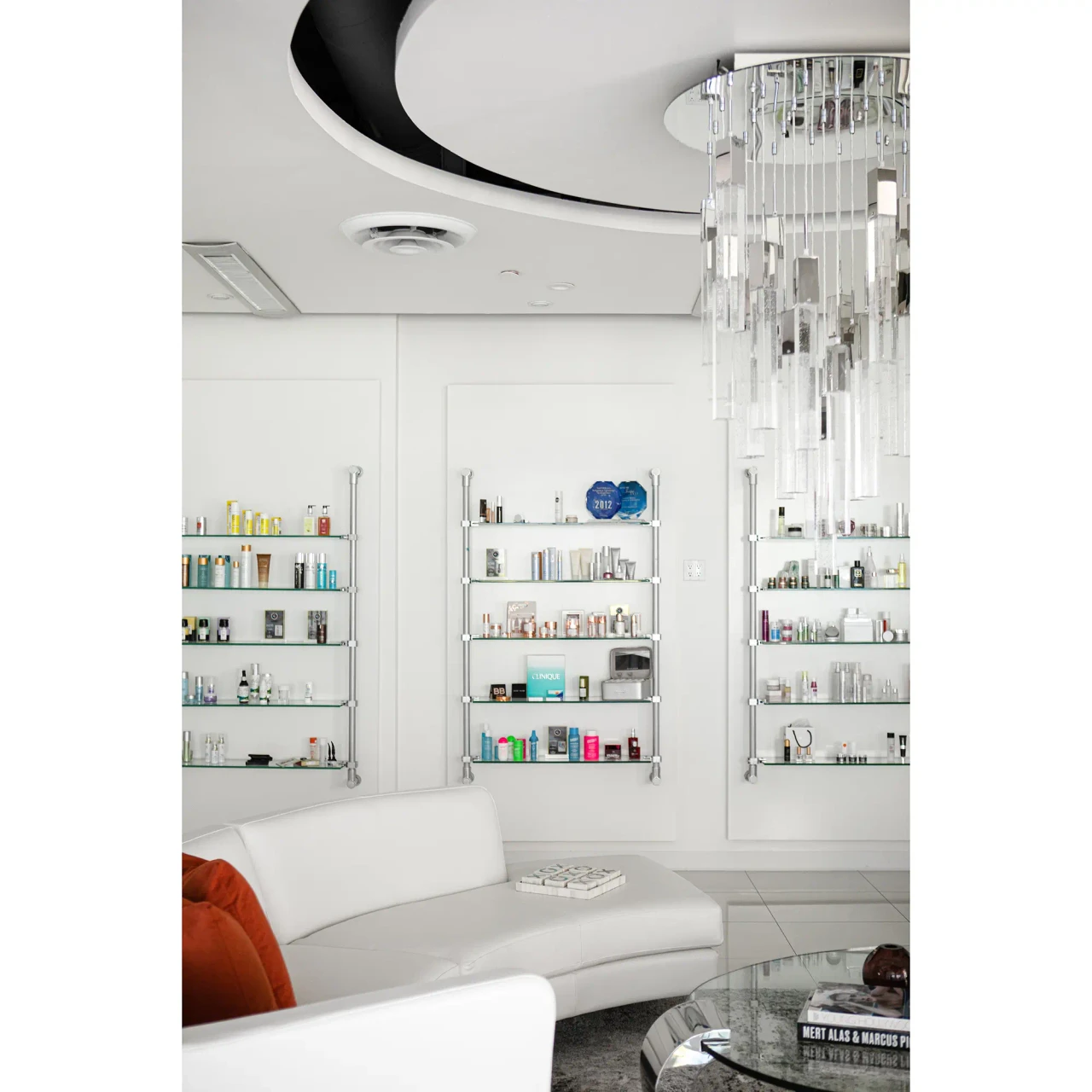 25 - Glacier Suspension Fixture in Polished Chrome and Bubbled Glass, modern style, living room setting, eye-level angle.