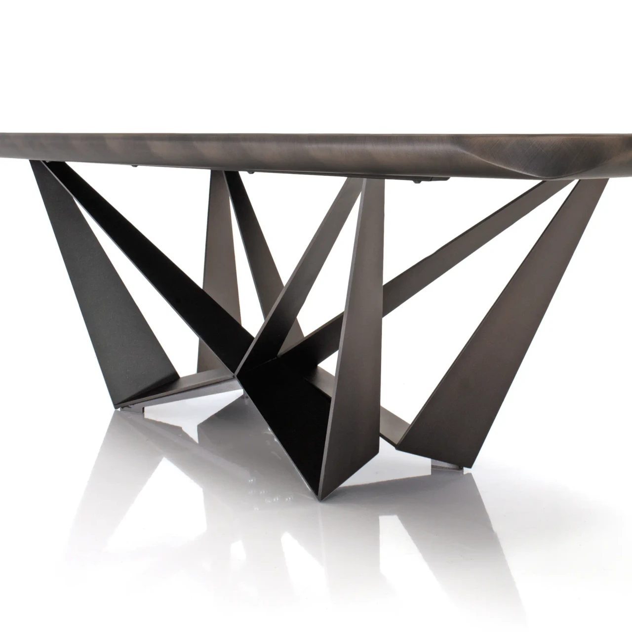 BRECCIA || 118 IN - Cattelan Skorpio Keramik Dining Table, embossed bronze steel base, geometric legs, low angle close-up view.