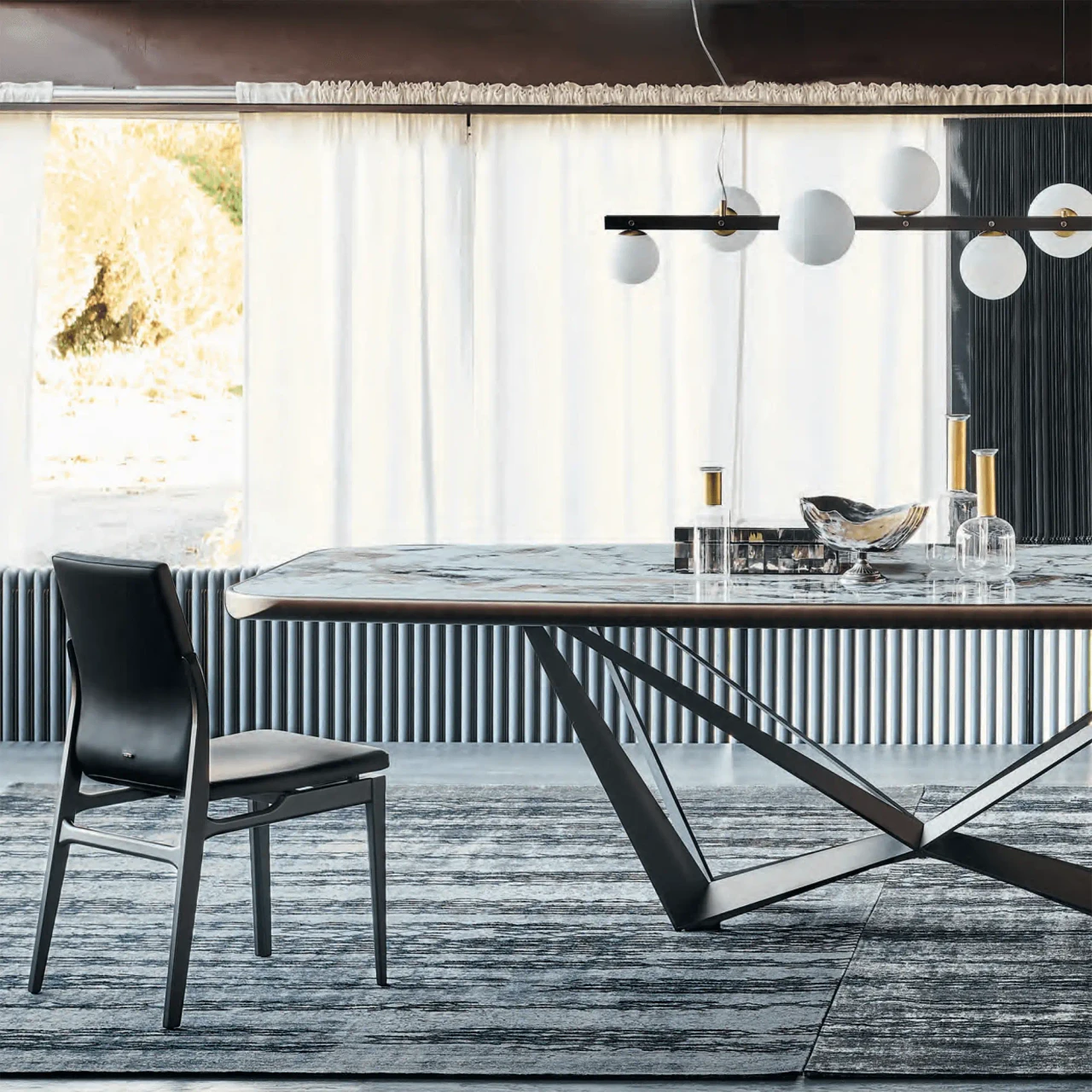 MAKALU || 94.5 IN - Cattelan Skorpio Keramik Premium Dining Table with Makalu Ceramic Top and Embossed Bronze Steel Base in a dining room
