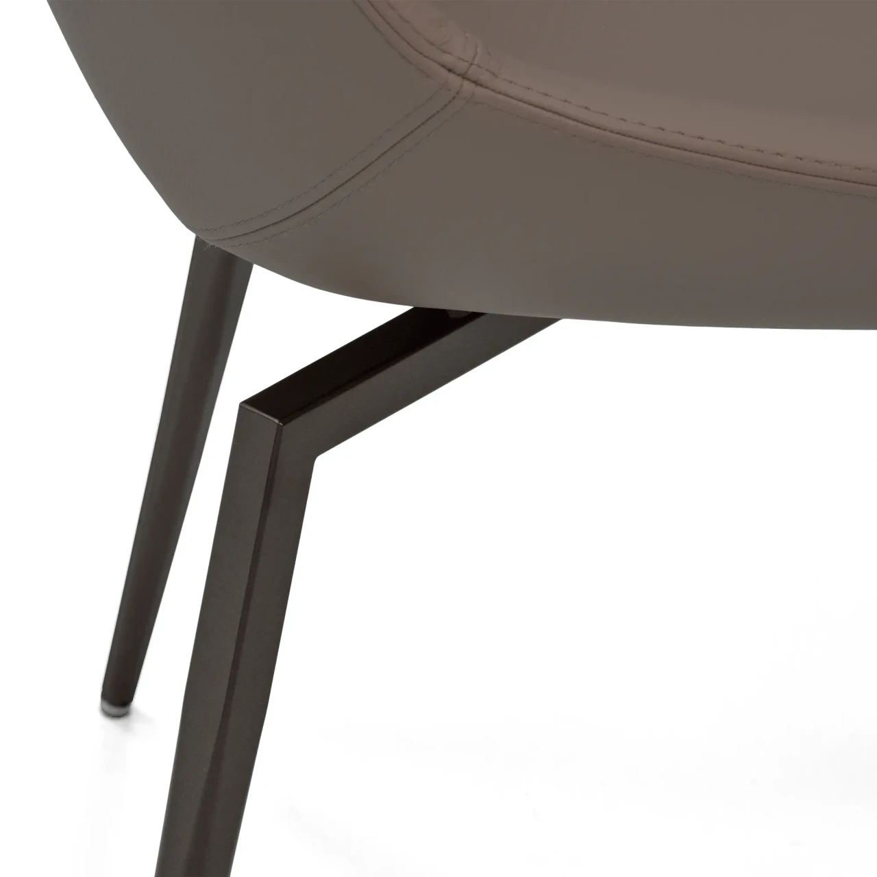 Closeup - Bonaldo Artika Side Chair close-up showing Capri Leather L34 seat and Matt Bronze Metal Legs from a low side angle.