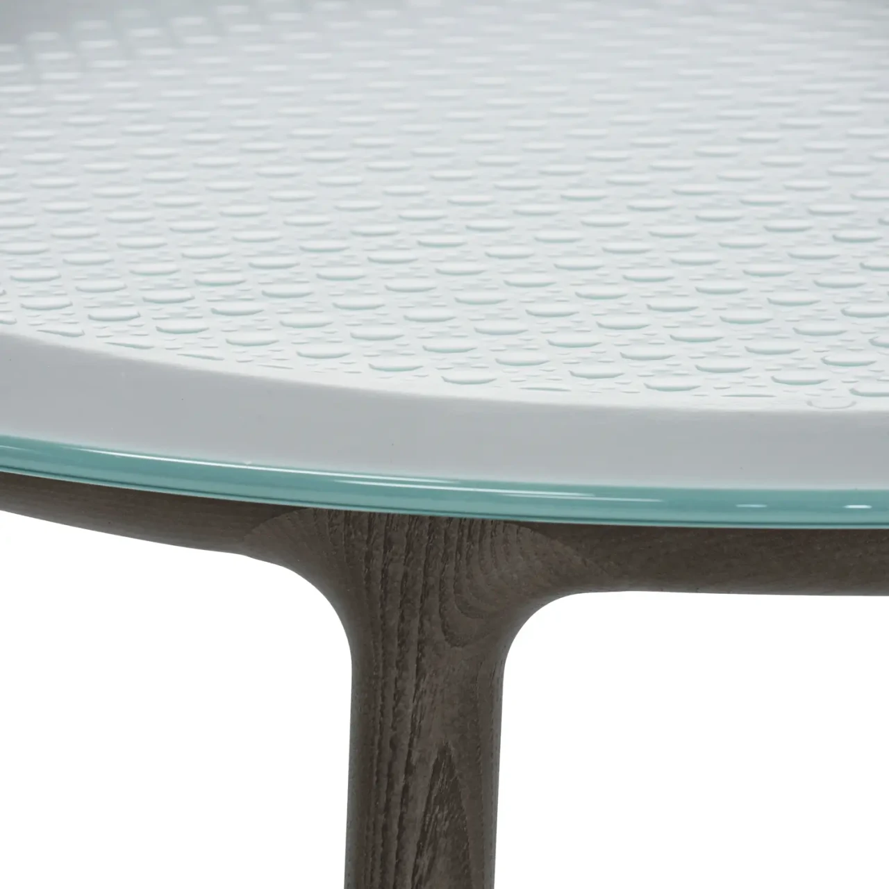 Closeup - Close-up of Fiam Cannage Cocktail Table with fused transparent glass top and solid tobacco oak frame base.