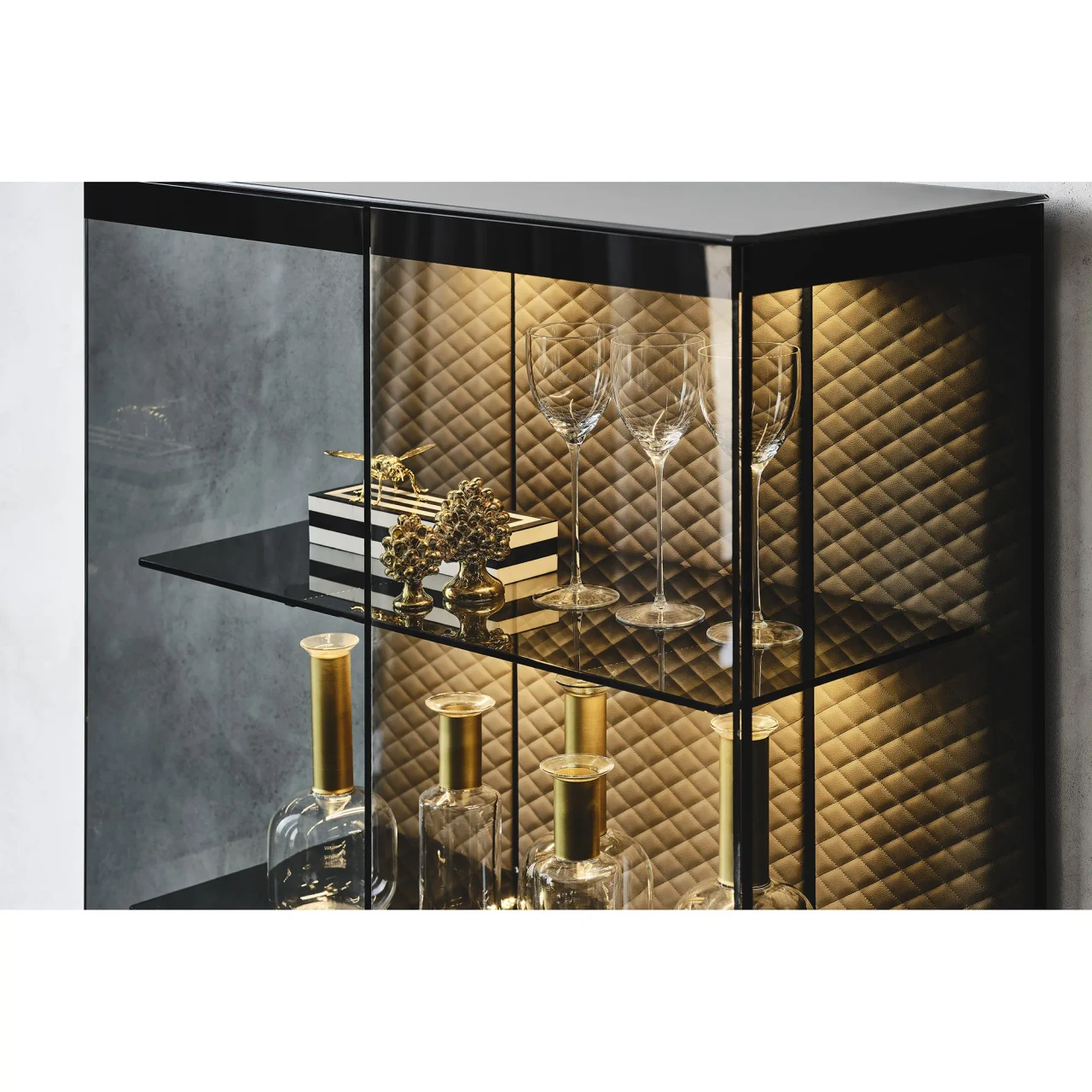 Cattelan Boutique Alta Display Case, black painted and fume glass, embossed steel base, close-up view in living room.