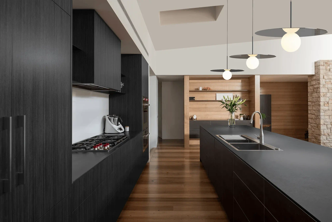 GUNMETAL || 22 IN - Pablo Bola Disc Pendant lights, Gunmetal Finish, Opal Glass Globe, modern kitchen setting, wide angle view