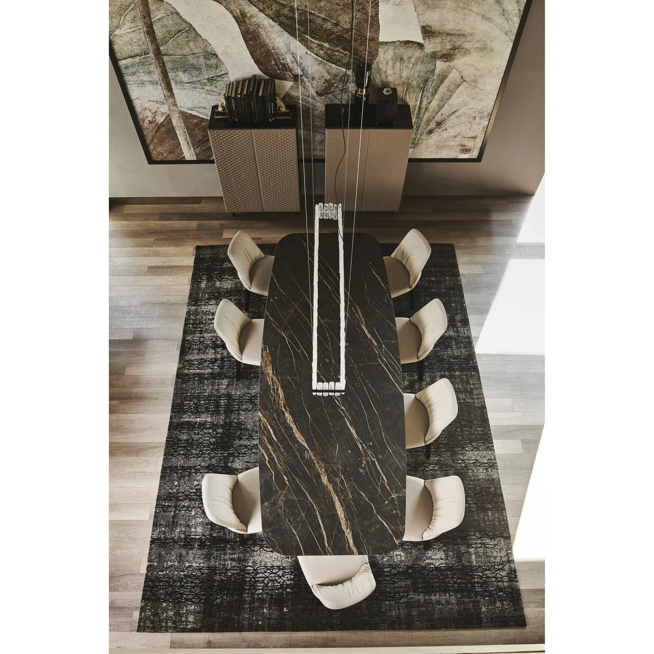 MATTE PORTORO || TITANIUM EMBOSSED STEEL - High-angle dining room view of Cattelan Skorpio Keramik Dining Table with Matt Portoro Ceramic Top and Titanium Steel Base.