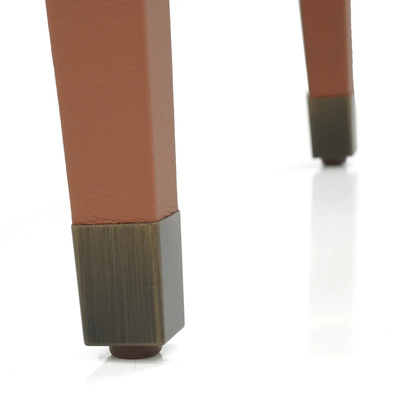 Closeup - Next Level Side Chair Bronze Leg Cap Detail