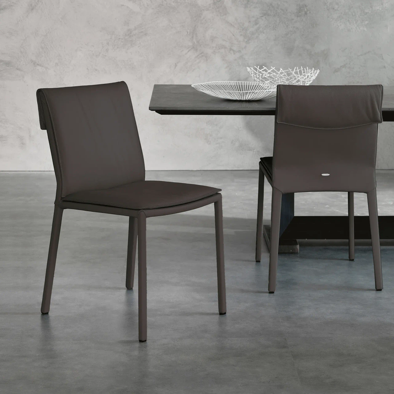 ARDESIA - Cattelan Isabel Side Chair in Ardesia Soft Leather, modern style, three-quarter and rear views in a dining room setting.