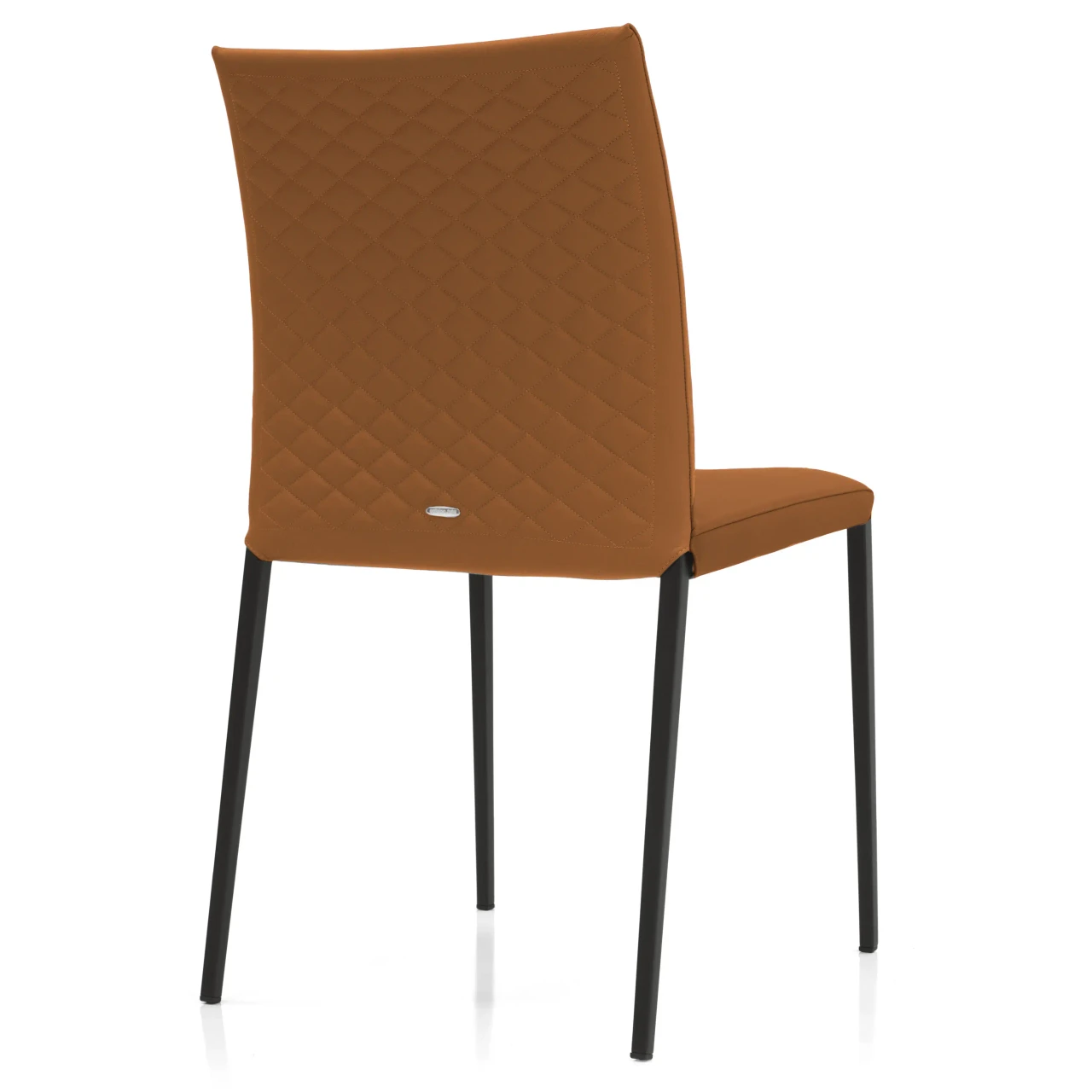 COGNAC - Rear view of a modern cognac brown faux leather dining chair with diamond quilted stitching and black metal legs.