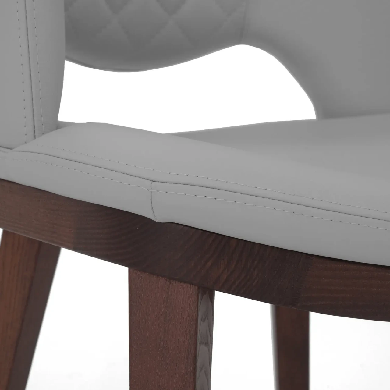 WINTER GREY || Closeup - Fashion Q Side Chair, Winter Grey leather seat and back, Noce Canaletto wood frame, close-up side angle view.