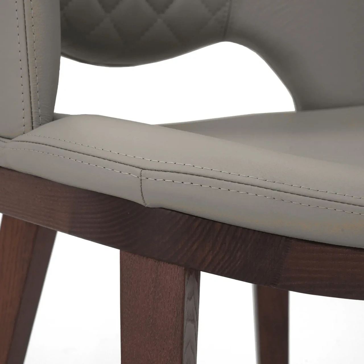 ASH GREY || Closeup - Fashion Q Side Chair, Ash Grey Leather Seat and Back, Noce Canaletto Wood Frame, close-up side angle view