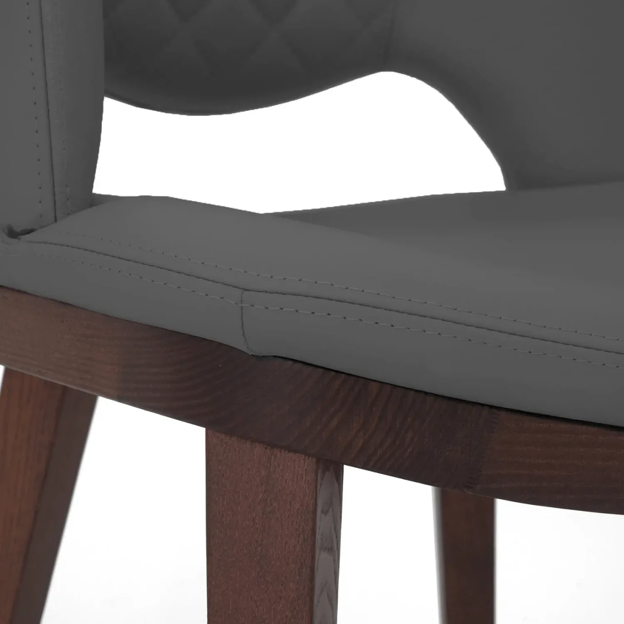 GREY || Closeup - Close-up side view of Fashion Q Side Chair with grey leather seat and Noce Canaletto wood frame.