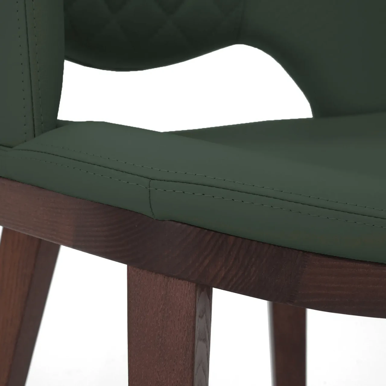 DARK GREEN || Closeup - Fashion Q Side Chair, dark green leather seat and back, Noce Canaletto wood frame, close-up side angle view.