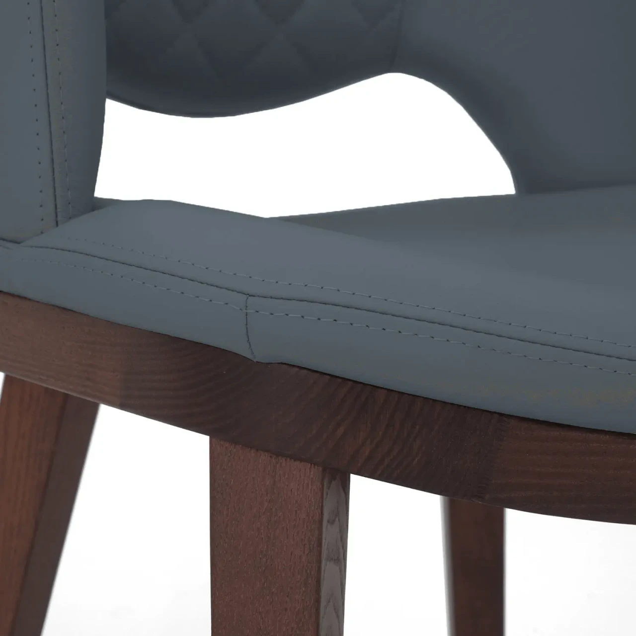BLUE || Closeup - Close-up side view of Fashion Q Side Chair with River Blue leather seat and Noce Canaletto wood frame.