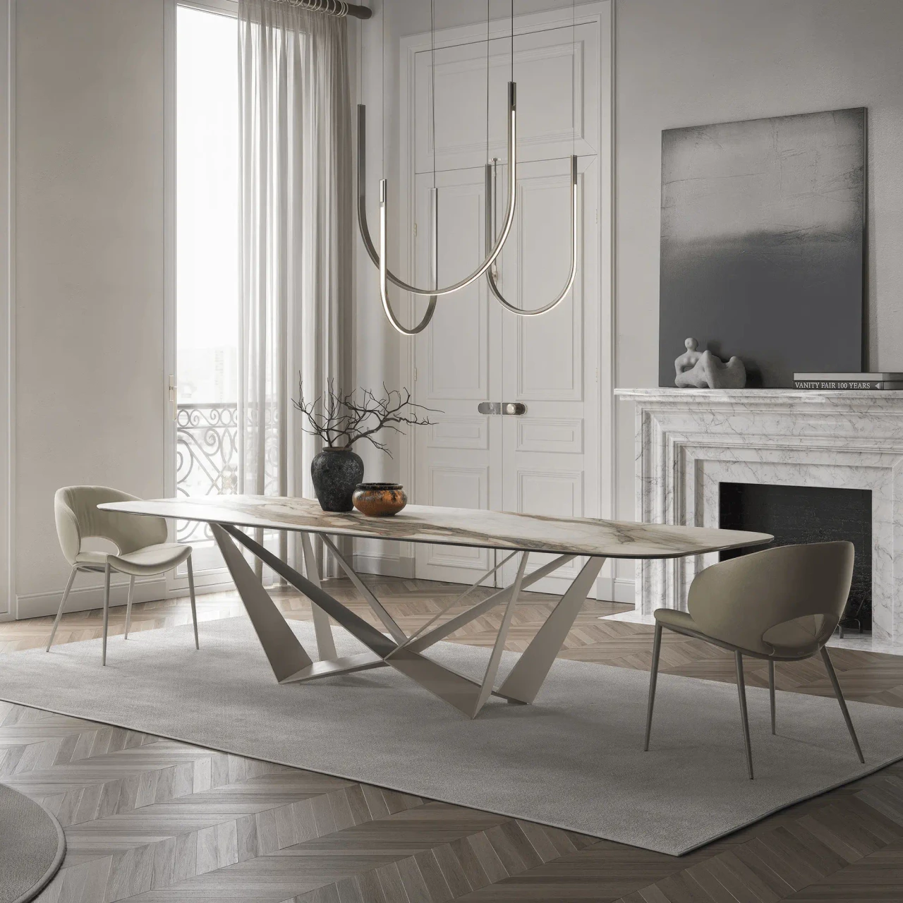 CASHMERE - Modern oval dining table with marble top and geometric metal base, viewed from a side angle in a minimalist room.