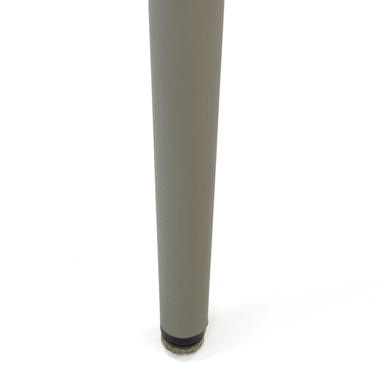 BEIGE || Closeup - Close-up view of a modern grey metal table leg with a protective felt floor glider at the base.