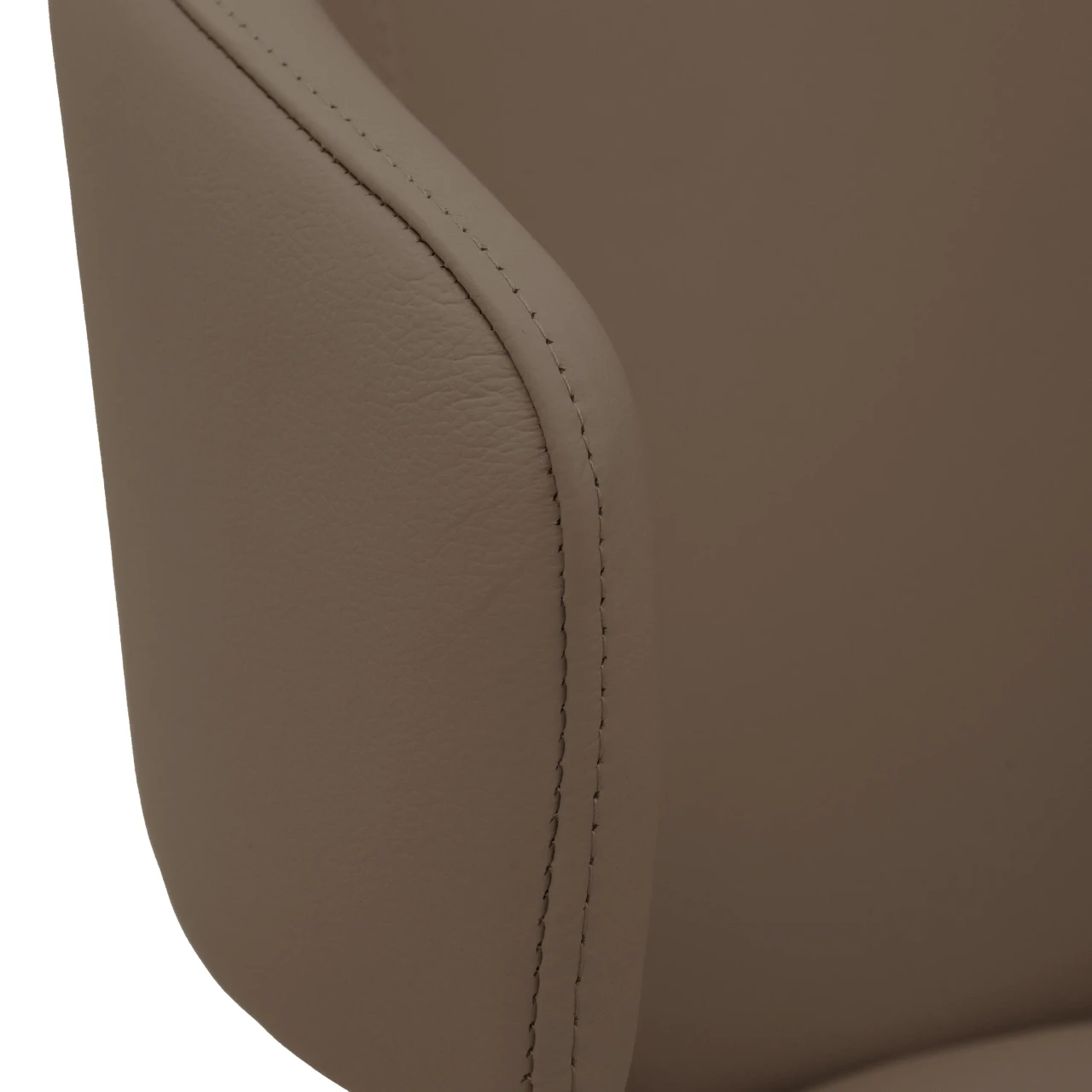 TAUPE || Closeup - Close-up side view of a taupe leather modern armchair featuring detailed topstitching on the armrest.