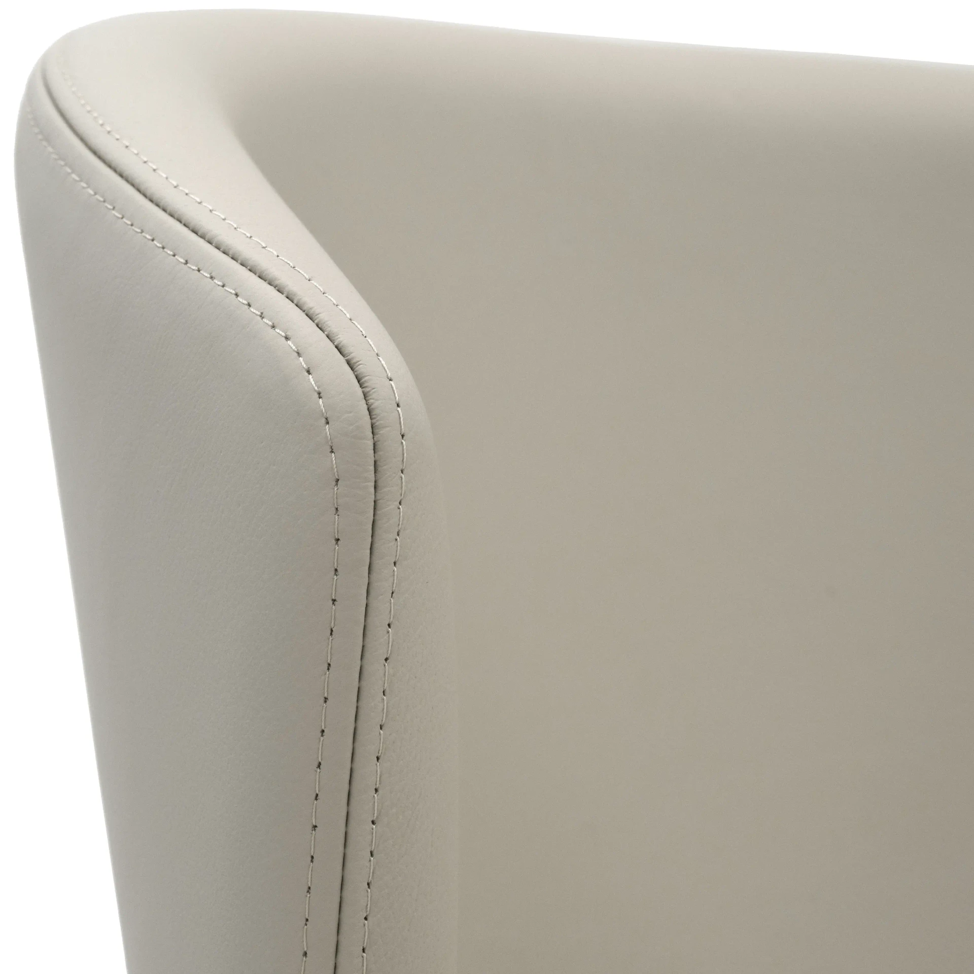 Closeup - Close-up angle of Tess Bar Stool beige leather seat and back featuring detailed topstitching.