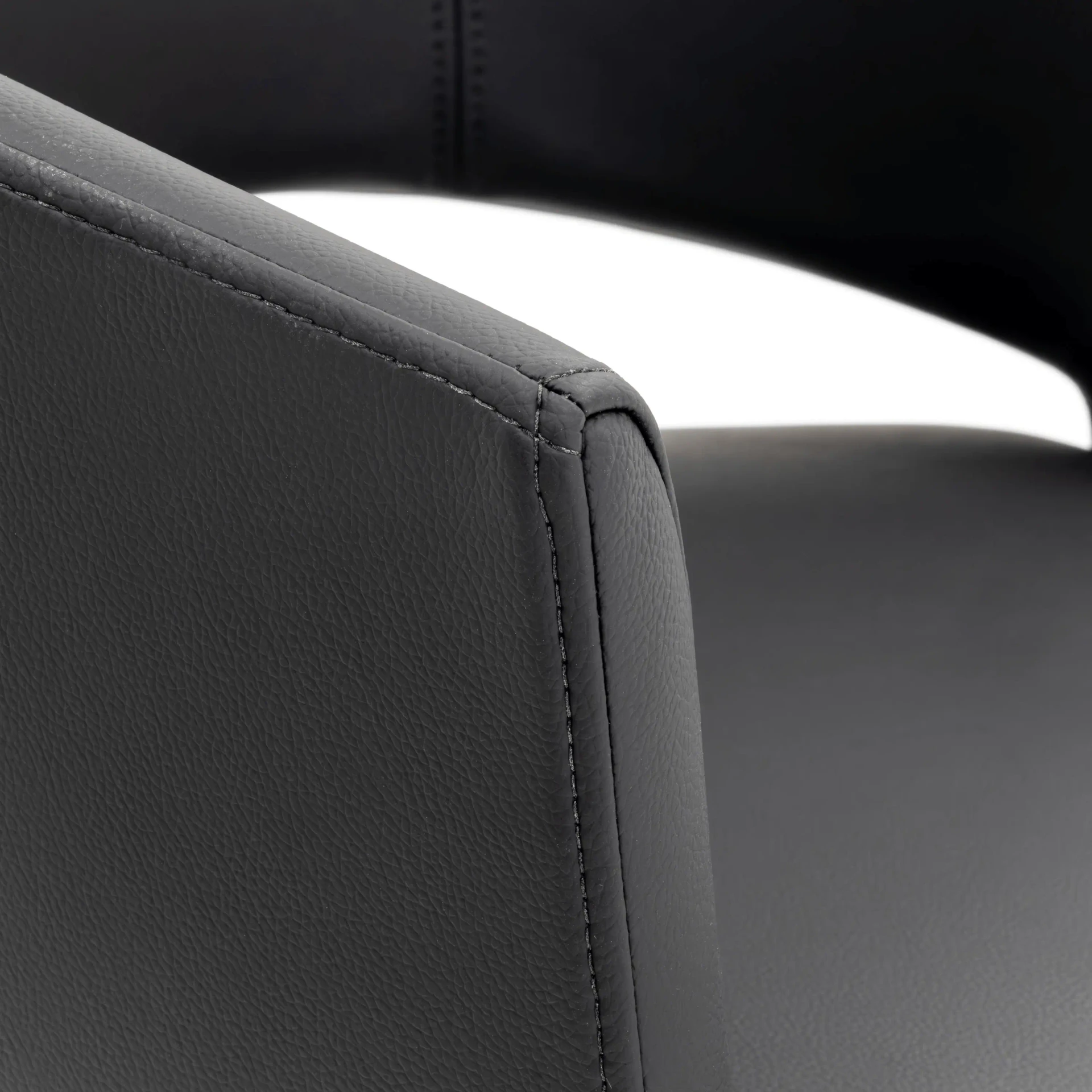 Closeup - Close-up angle of Circa Adjustable Bar Stool in Lavish Obsidian EcoPelle showing stitched leather detail and curved armrest.