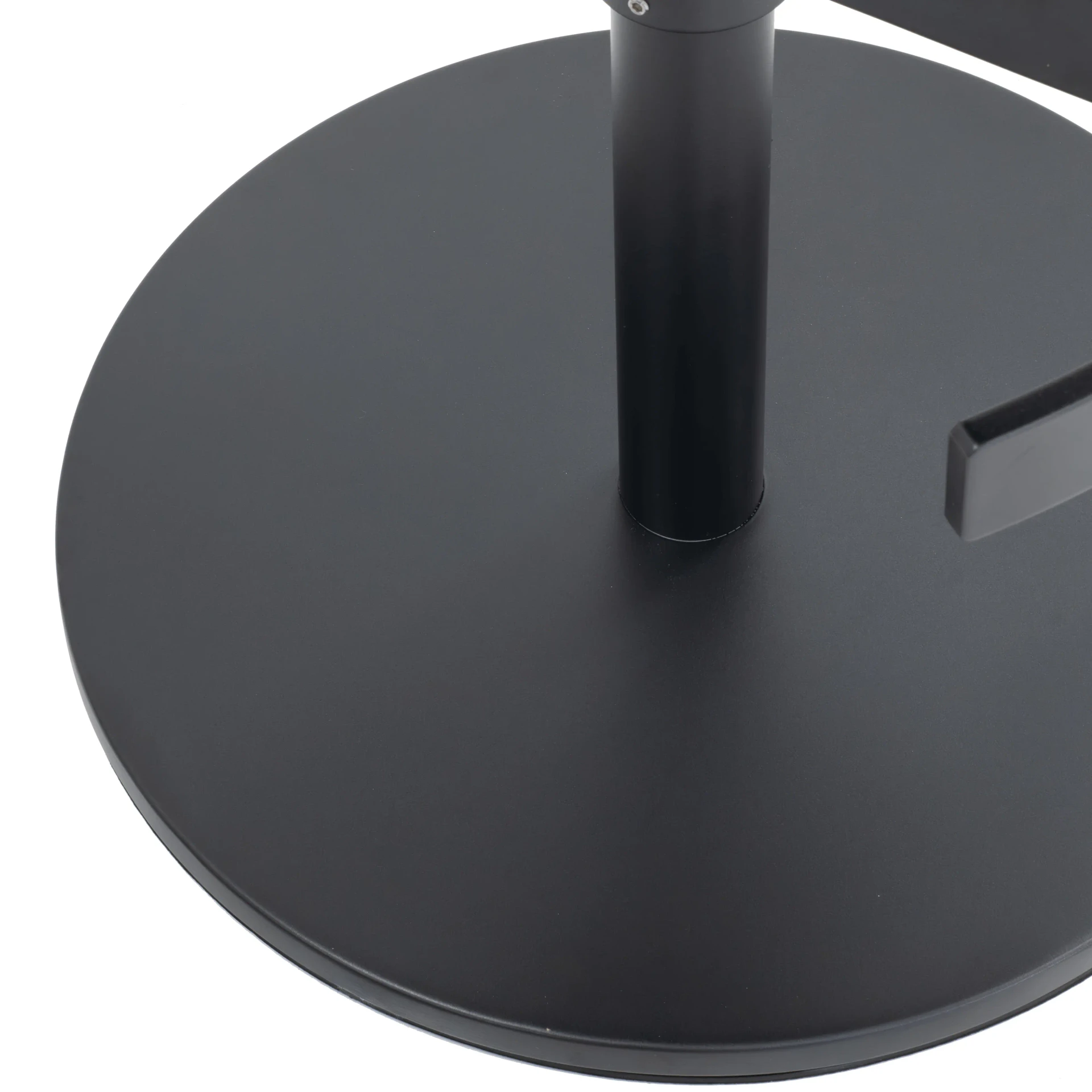 Closeup - Close-up angle of Circa Adjustable Bar Stool black metal circular base with carbon frame post and footrest.