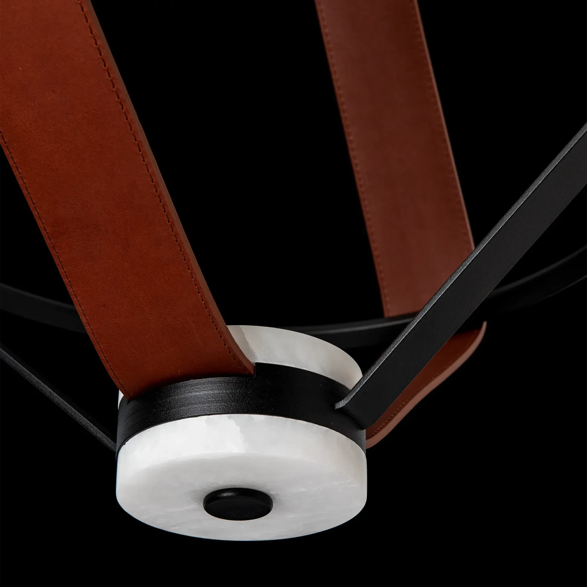 Closeup - Close-up of Aspen Led Small Pendant, black metal, chestnut leather and alabaster, modern style, bottom detail angle.