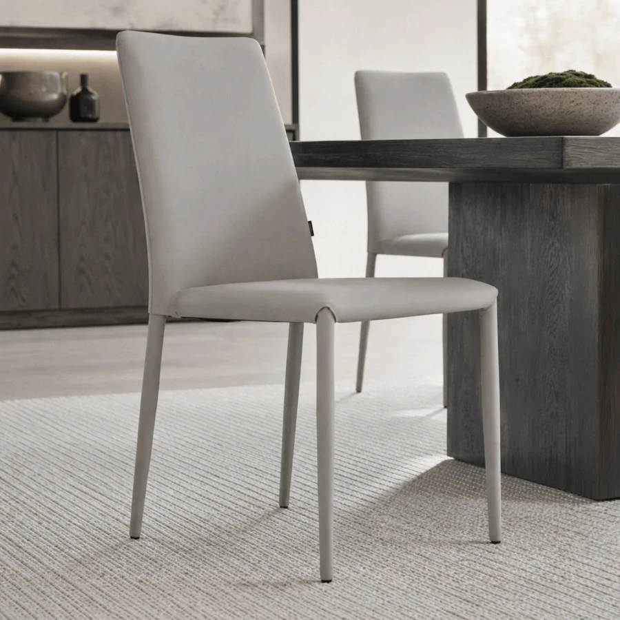 LIGHT GREY ECOPELLE - Bontempi Casa Malik Flex Side Chair in Light Grey EcoPelle with Flexible Ergonomix Back, side view in dining room setting.