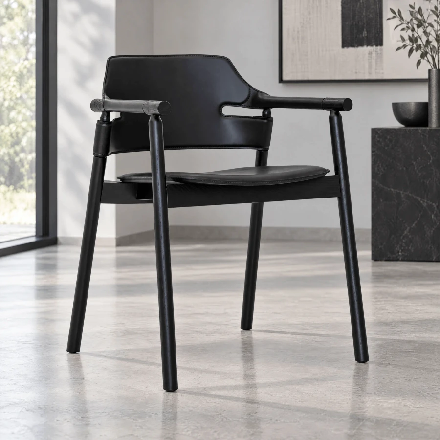 BLACK - Suite P Arm Chair, modern style, black hide leather and lacquered ash frame, side view in a minimalist living room setting.