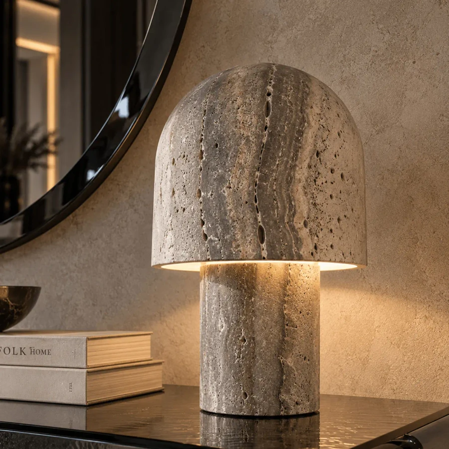 Kennett Small Table Lamp in Dark Travertine, modern style, stone material, dimmable LED, eye-level view in a living room.