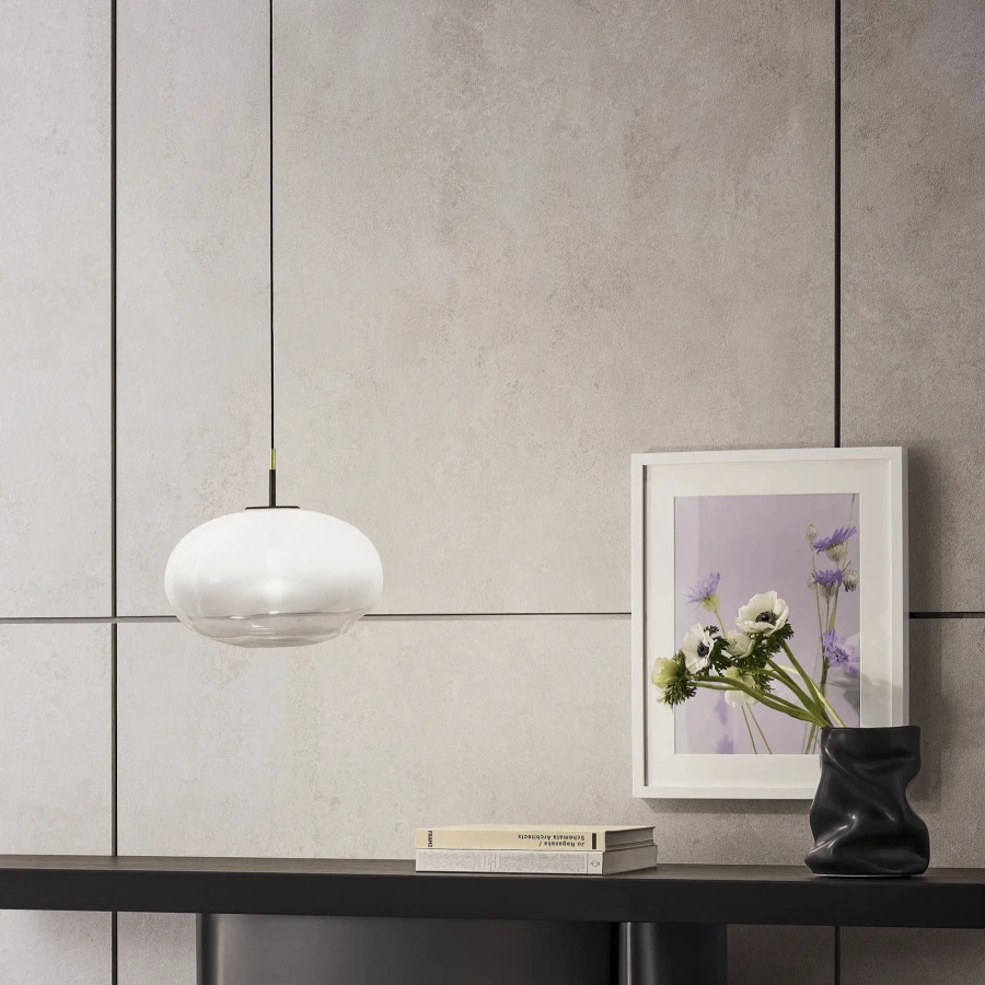 Bonaldo Pepita Pendant light in silk hand-blown glass and matt brass, modern style, living room setting, side view.