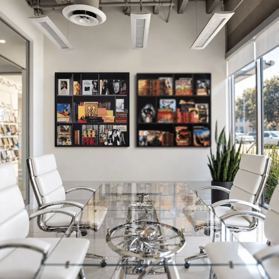 Story Of My Life - Part I photographic prints on plexi with black wooden frames in a modern office, front view.