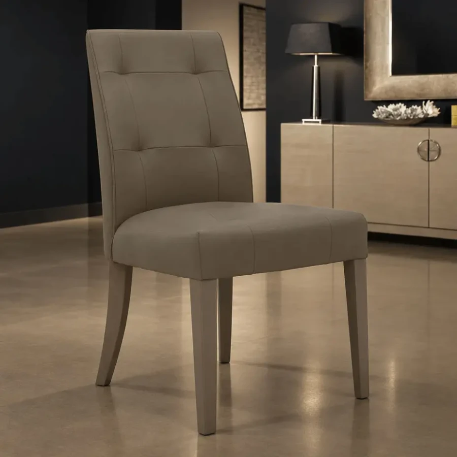 Malerba M Place dining chair in C33 Taupe Leather, modern style with tufted back, 3/4 view in a dining room setting.