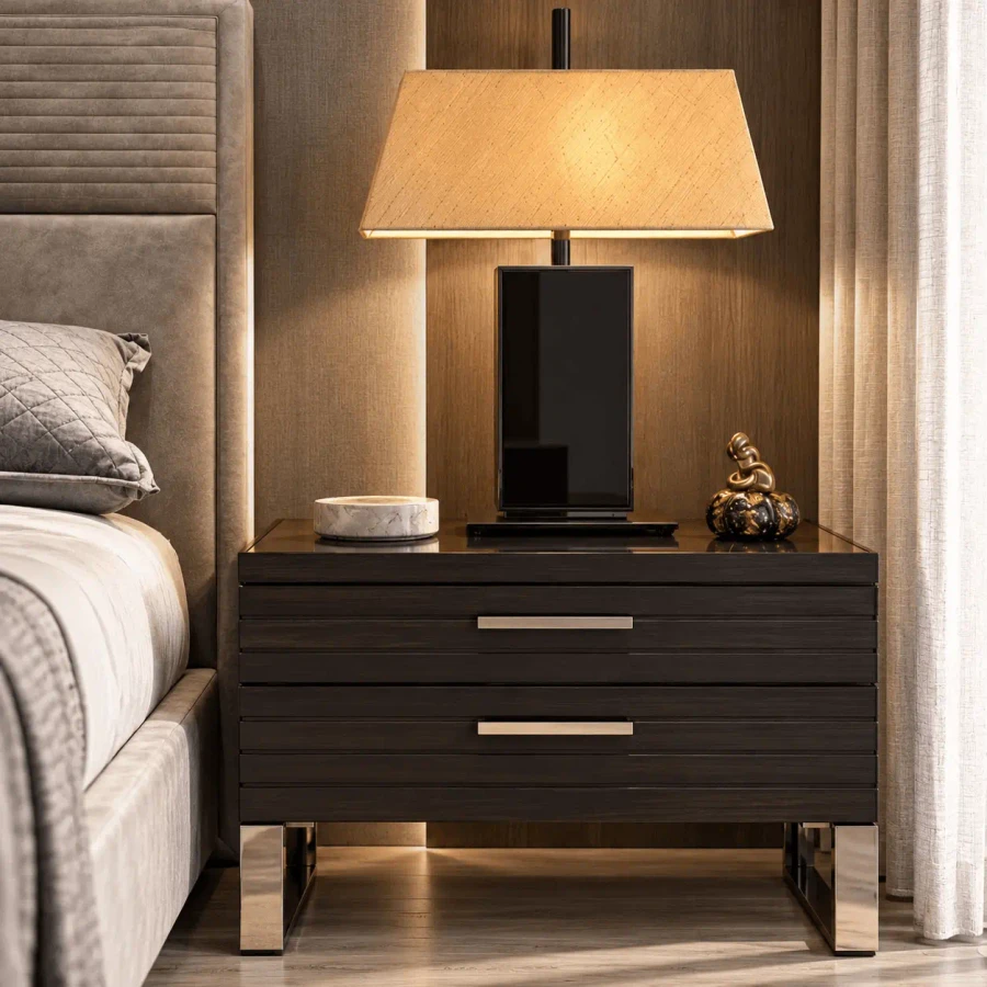 Malerba Black & More Table Lamp with Saffron Shade and Black Glass base on a black nightstand in a bedroom, front view.