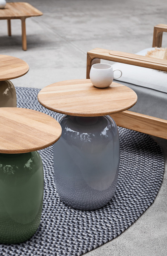 SMOKE || EMERALD - Image Courtesy of Gloster Furniture, Inc | Blow High Side Table Shown in an Outdoor Setting